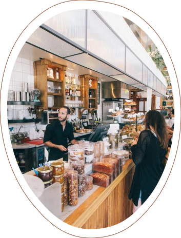 Barista serving a woman